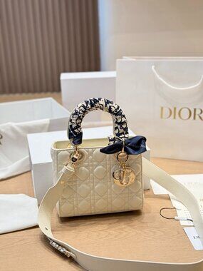 Dior. white clutch
